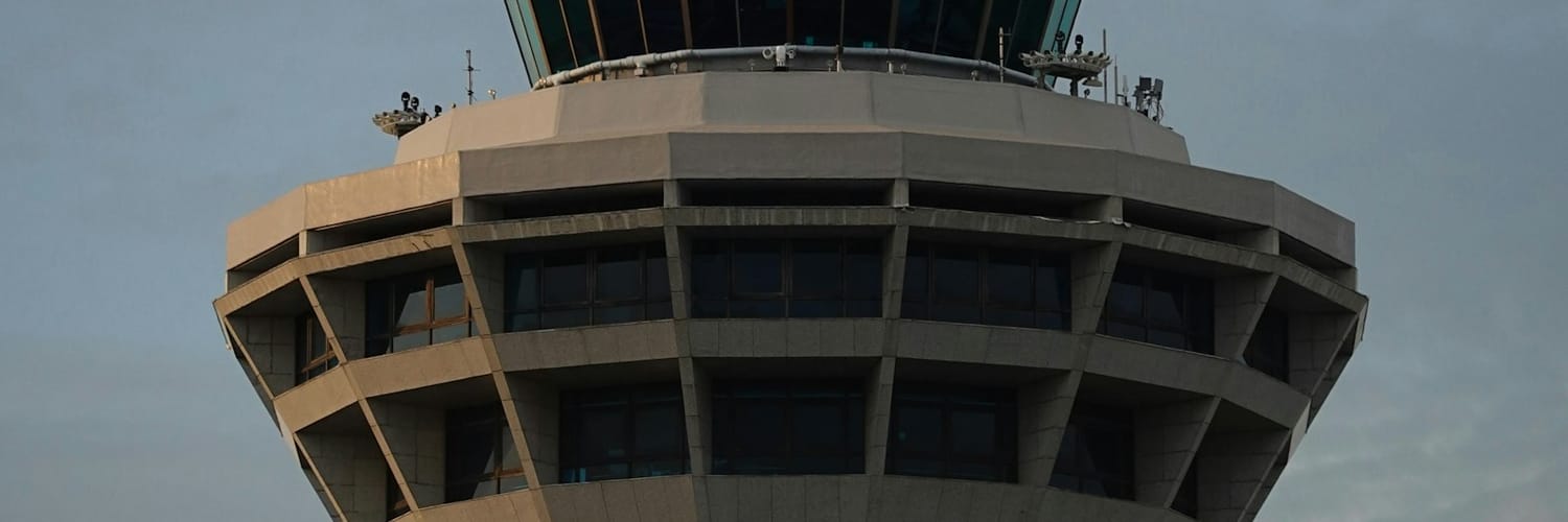 A modern airport air traffic control tower, where air traffic control officers work A modern airport air traffic control tower, where air traffic control officers work